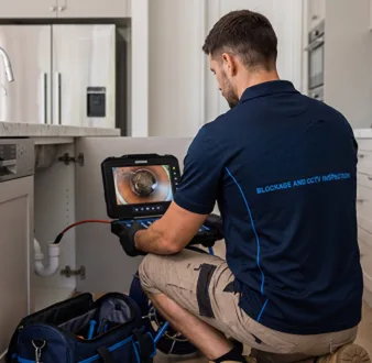 Clearing a blocked sink at a Stanhope Gardens property